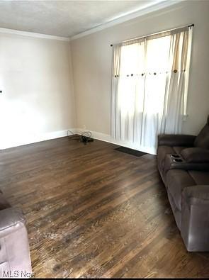 120 Welday Ave, Steubenville, OH 43952 - living area featuring dark wood-style flooring and crown molding