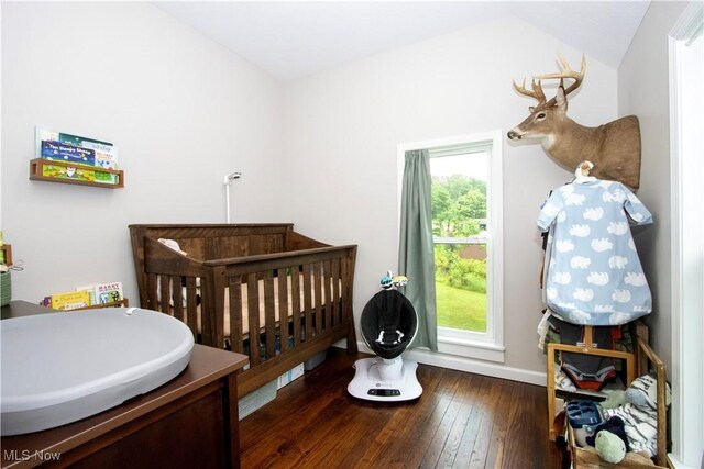 4234 Swigart Rd, Bellville, OH 44813 - bedroom featuring a nursery area and hardwood / wood-style floors
