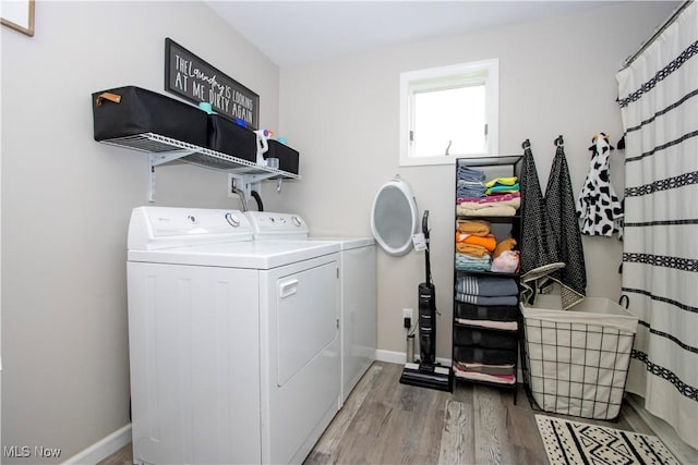 4234 Swigart Rd, Bellville, OH 44813 - laundry area featuring washing machine and clothes dryer and light wood-style floors