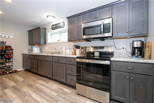 4234 Swigart Rd, Bellville, OH 44813 - kitchen featuring stainless steel appliances and light wood-style floors