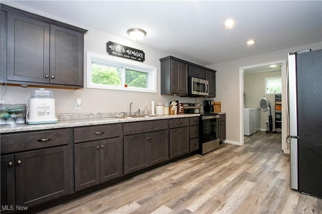 4234 Swigart Rd, Bellville, OH 44813 - kitchen featuring stainless steel appliances, light wood finished floors, light countertops, dark brown cabinetry, and recessed lighting