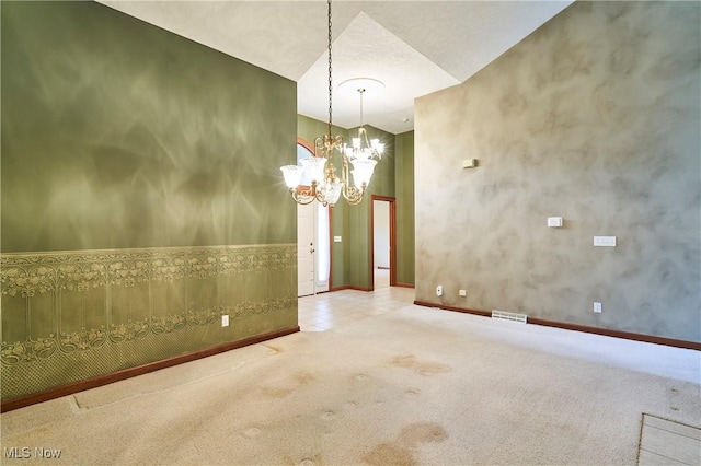 1977 Fox Trace Trl, Cuyahoga Falls, OH 44223 - carpeted spare room featuring a chandelier and baseboards