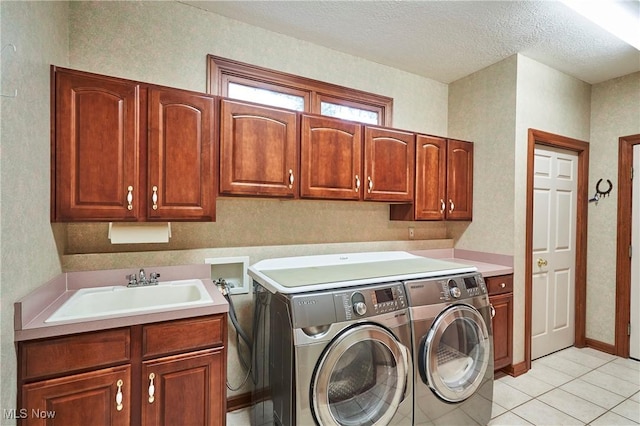 1977 Fox Trace Trl, Cuyahoga Falls, OH 44223 - laundry room featuring cabinet space, separate washer and dryer, light tile patterned floors, and a textured ceiling
