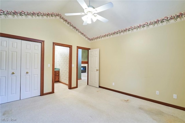 1977 Fox Trace Trl, Cuyahoga Falls, OH 44223 - unfurnished bedroom featuring light carpet, lofted ceiling, a closet, and ceiling fan