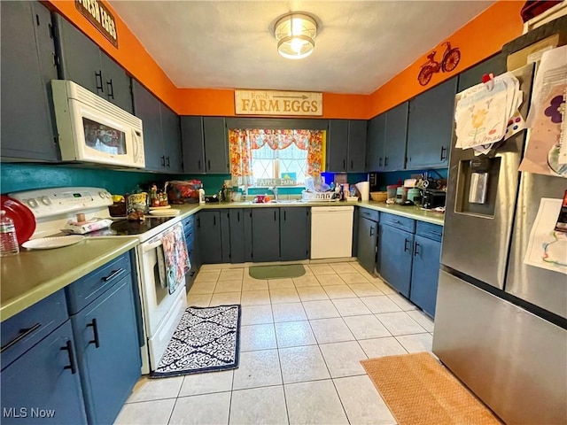 311 Hilda Cir, Bloomingdale, OH 43910 - kitchen with white appliances, light tile patterned floors, and light countertops