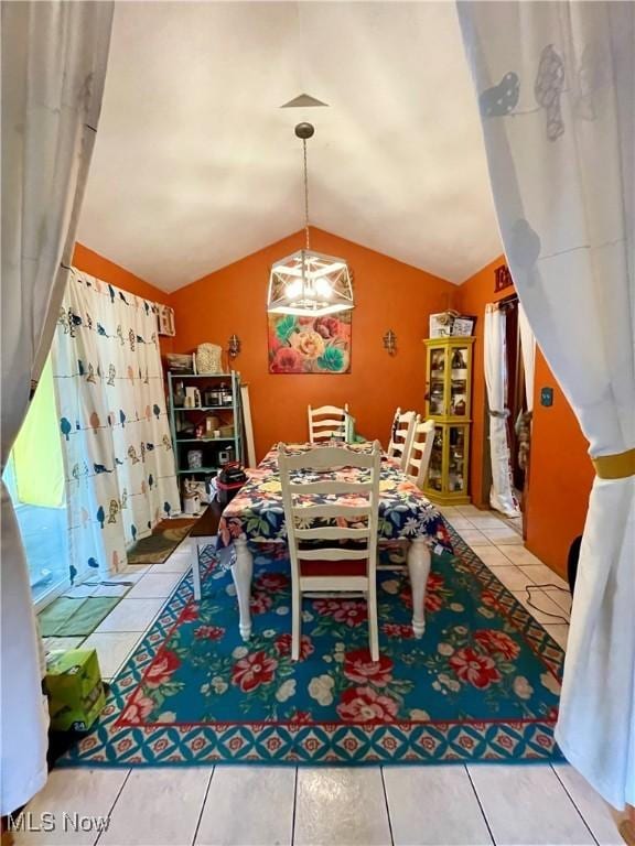 311 Hilda Cir, Bloomingdale, OH 43910 - tiled dining room featuring vaulted ceiling and a chandelier