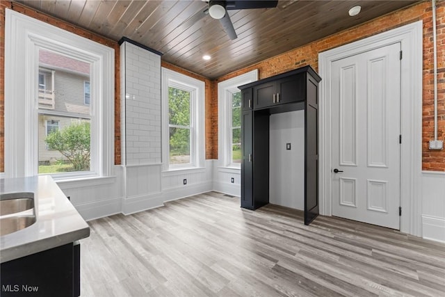 638 High St, Wooster, OH 44691 - interior space with ceiling fan, light wood-type flooring, wood ceiling, a wainscoted wall, and brick wall
