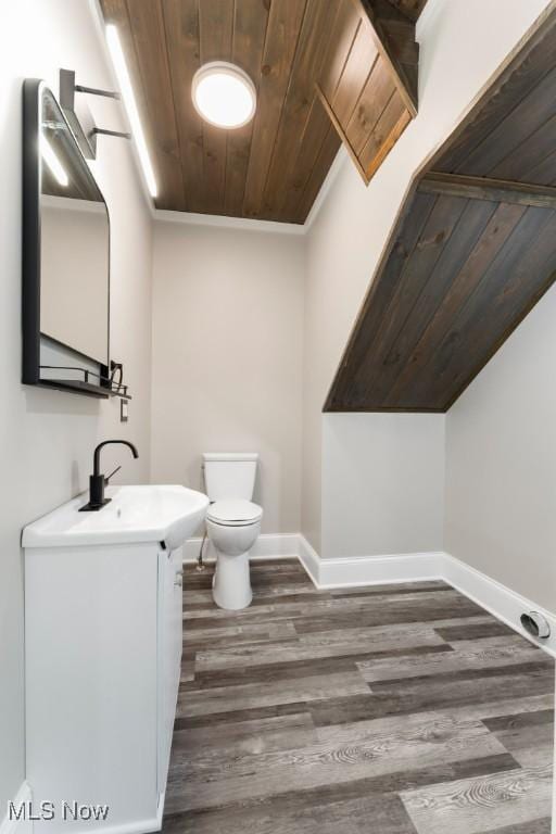 638 High St, Wooster, OH 44691 - bathroom featuring wood ceiling, vanity, wood finished floors, and ornamental molding