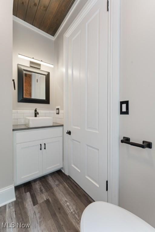 638 High St, Wooster, OH 44691 - bathroom with vanity, wood finished floors, wooden ceiling, and ornamental molding
