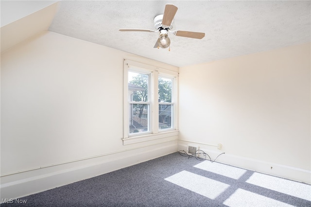 289 E Baird Ave, Barberton, OH 44203 - empty room with a textured ceiling, carpet flooring, and ceiling fan