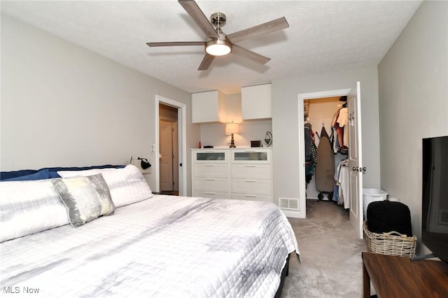4914 Independence Cir Unit D, Stow, OH 44224 - carpeted bedroom with a spacious closet, a closet, and a ceiling fan