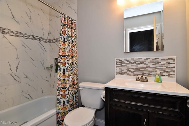 4914 Independence Cir Unit D, Stow, OH 44224 - bathroom featuring decorative backsplash, vanity, and shower / bath combination with curtain