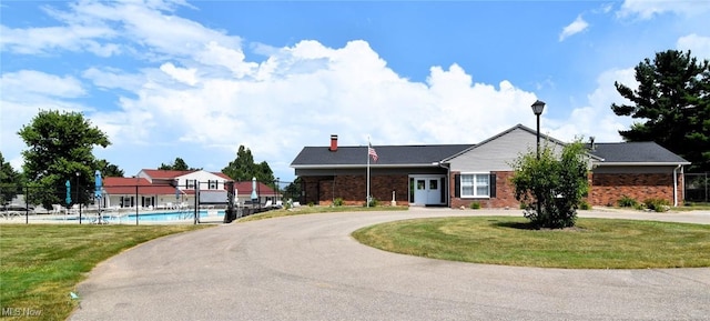4914 Independence Cir Unit D, Stow, OH 44224 - view of property with curved driveway and a community pool