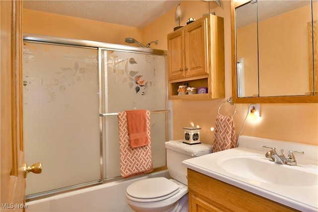 2555 Walnut St, Girard, OH 44420 - bathroom featuring vanity, enclosed tub / shower combo, and a textured ceiling