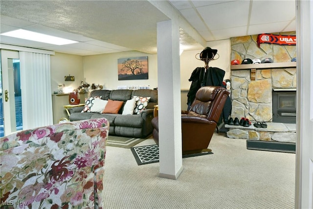 2555 Walnut St, Girard, OH 44420 - carpeted living room featuring a paneled ceiling and a stone fireplace