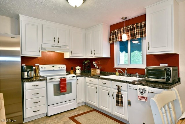 2555 Walnut St, Girard, OH 44420 - kitchen featuring freestanding refrigerator, white electric range, under cabinet range hood, dishwasher, and white cabinets