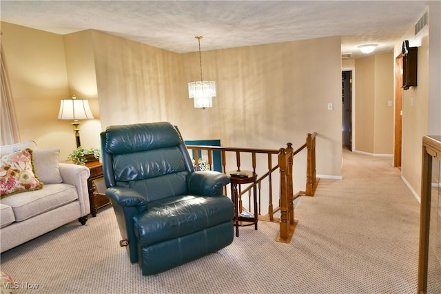 2555 Walnut St, Girard, OH 44420 - sitting room with an upstairs landing, carpet, and a chandelier