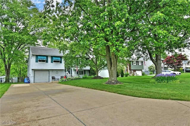 2555 Walnut St, Girard, OH 44420 - view of front of property with driveway, an attached garage, and a front yard