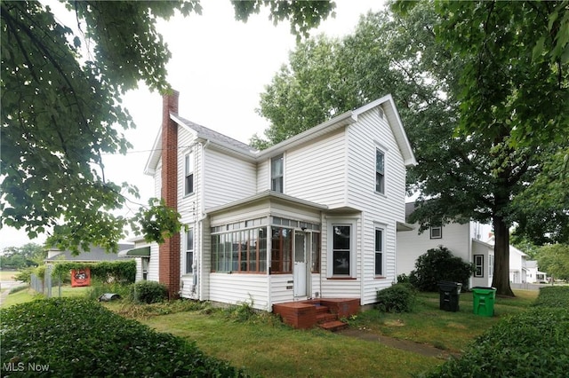 625 W Church St, Orrville, OH 44667 - view of property exterior featuring a chimney