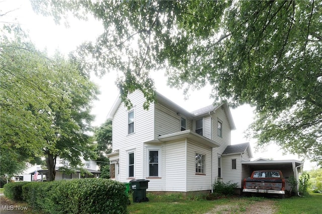625 W Church St, Orrville, OH 44667 - view of property exterior with a carport