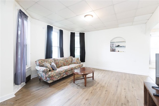 625 W Church St, Orrville, OH 44667 - living area featuring a drop ceiling, wood finished floors, and arched walkways