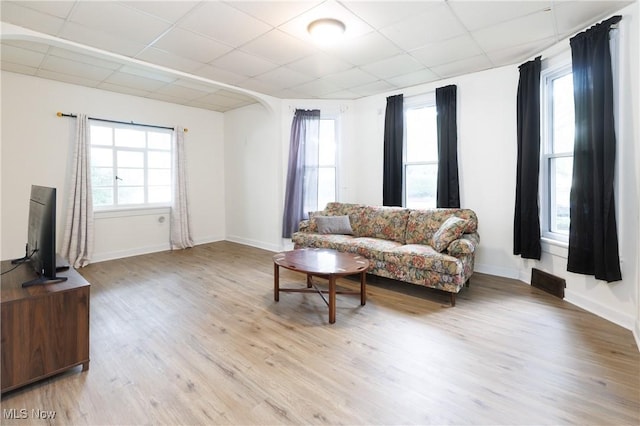 625 W Church St, Orrville, OH 44667 - living area with a paneled ceiling, light wood-type flooring, and arched walkways