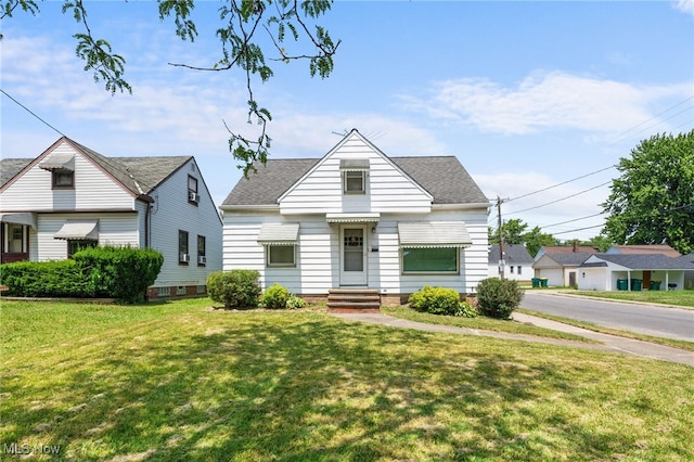 15617 Rockside Rd, Maple Heights, OH 44137 - bungalow featuring a front lawn and roof with shingles