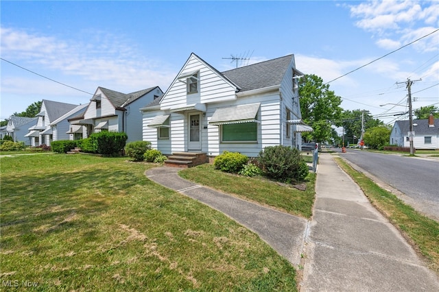 15617 Rockside Rd, Maple Heights, OH 44137 - bungalow-style home with a front yard, a shingled roof, and a residential view