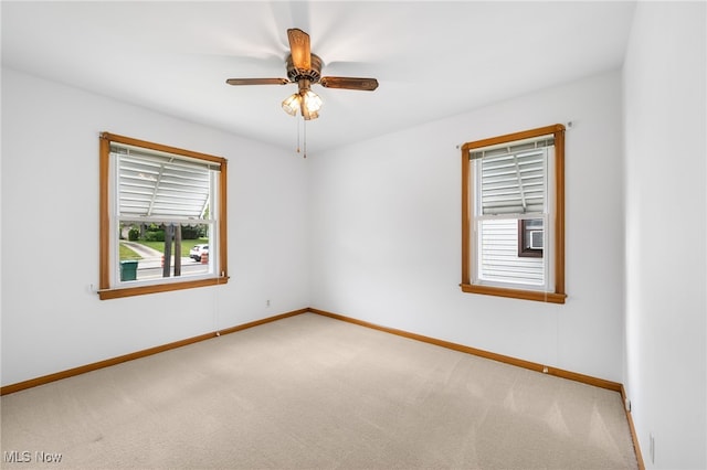 15617 Rockside Rd, Maple Heights, OH 44137 - carpeted empty room with baseboards and a ceiling fan