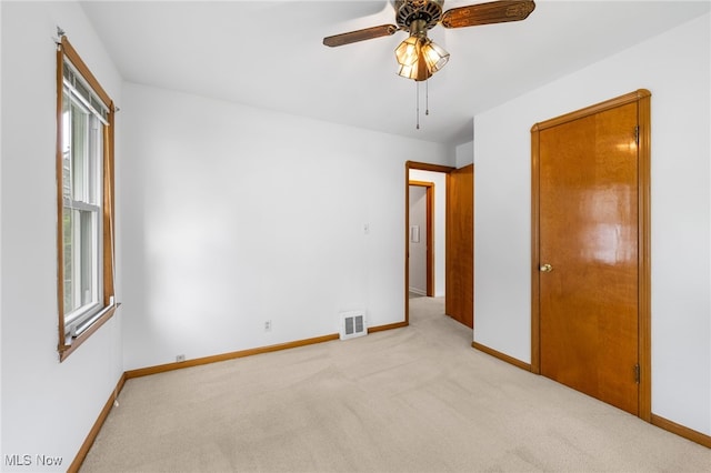 15617 Rockside Rd, Maple Heights, OH 44137 - unfurnished bedroom featuring light colored carpet and ceiling fan