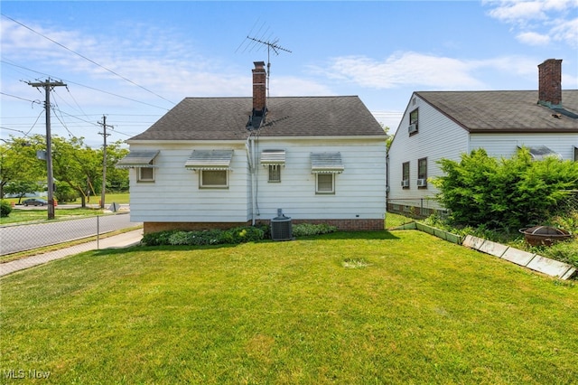 15617 Rockside Rd, Maple Heights, OH 44137 - back of property featuring a chimney and roof with shingles