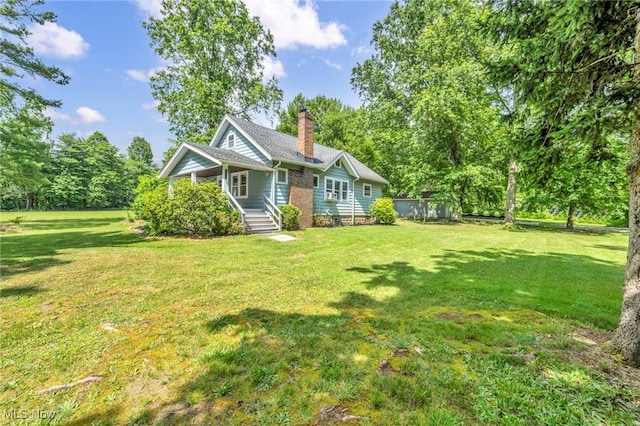 1425 Keefer Rd, Girard, OH 44420 - ranch-style house featuring a front yard and a chimney