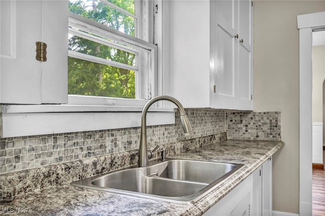1425 Keefer Rd, Girard, OH 44420 - kitchen with white cabinets and backsplash