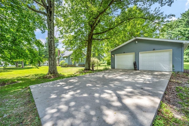 1425 Keefer Rd, Girard, OH 44420 - view of front of home with an outdoor structure, a front yard, and a garage