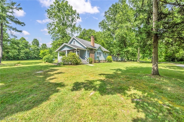 1425 Keefer Rd, Girard, OH 44420 - view of grassy yard with covered porch