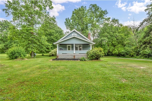 1425 Keefer Rd, Girard, OH 44420 - view of front of home featuring a front yard, a porch, and a chimney