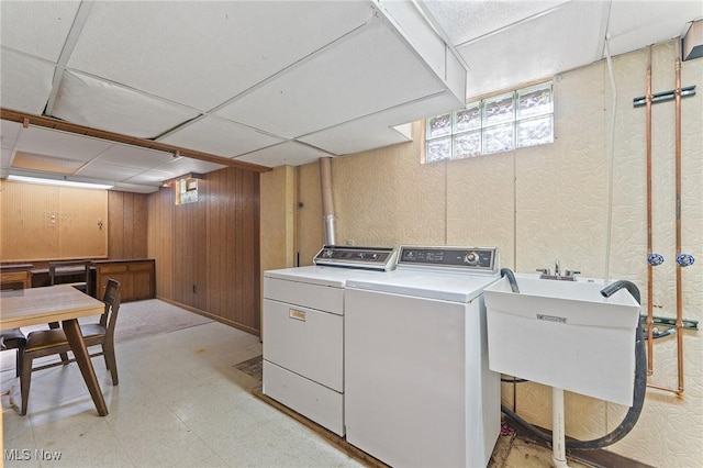 853 Almasy Dr, Campbell, OH 44405 - washroom featuring light flooring, washer and dryer, wood walls, and a textured wall