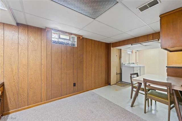 853 Almasy Dr, Campbell, OH 44405 - basement featuring wood walls, washer and clothes dryer, and a drop ceiling
