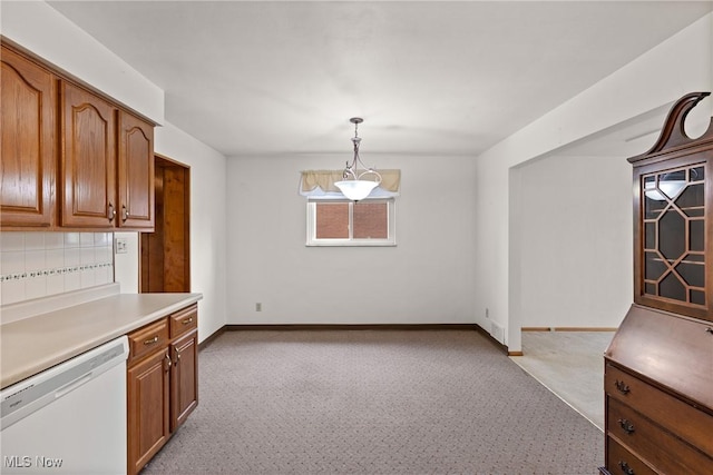 4134 Brightway St, Weirton, WV 26062 - kitchen with white dishwasher, brown cabinetry, light countertops, and hanging light fixtures