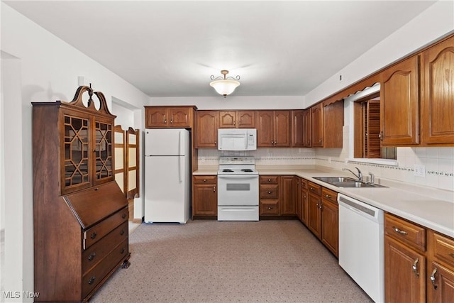 4134 Brightway St, Weirton, WV 26062 - kitchen featuring white appliances, tasteful backsplash, and brown cabinets