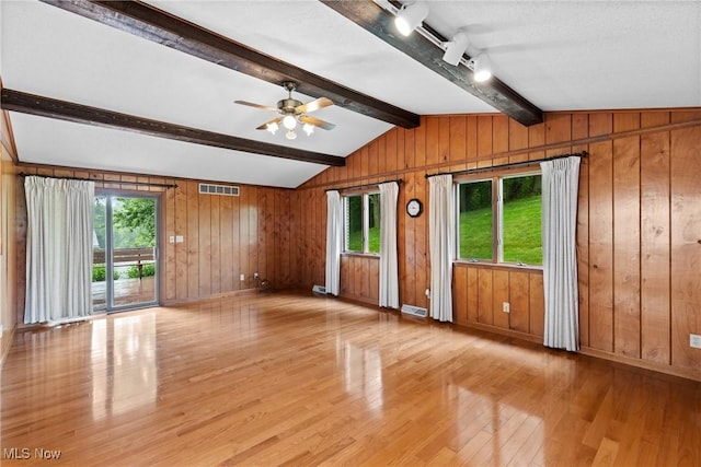 4134 Brightway St, Weirton, WV 26062 - unfurnished living room with light wood-type flooring, healthy amount of natural light, ceiling fan, wooden walls, and rail lighting