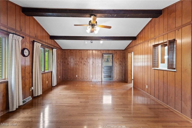 4134 Brightway St, Weirton, WV 26062 - spare room with light wood-style flooring, wood walls, and a ceiling fan