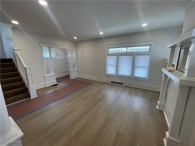 3363 E 125th St, Cleveland, OH 44120 - entryway featuring ornamental molding, ornate columns, stairway, wood finished floors, and recessed lighting