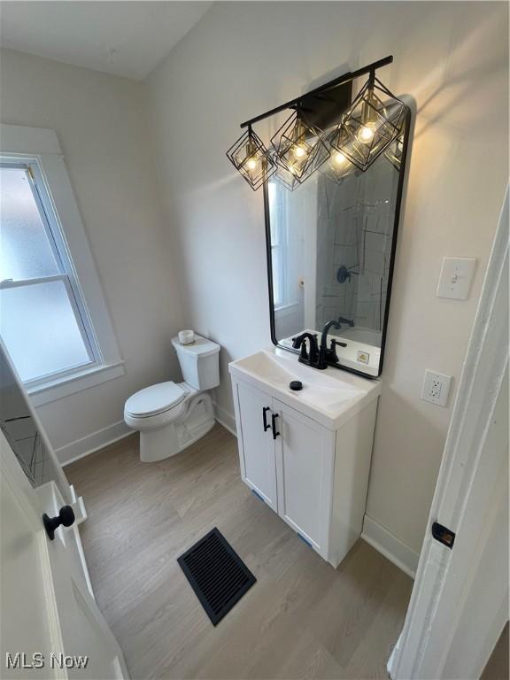 3363 E 125th St, Cleveland, OH 44120 - bathroom with vanity and wood finished floors
