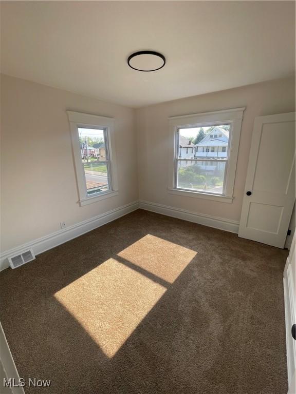 3363 E 125th St, Cleveland, OH 44120 - carpeted spare room with baseboards