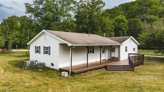 3917 Walker Rd, Walker, WV 26180 - rear view of property with a yard, roof with shingles, and a view of trees