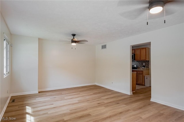 3917 Walker Rd, Walker, WV 26180 - unfurnished room with a ceiling fan and light wood finished floors
