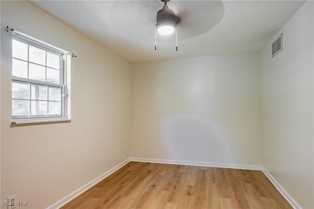 3917 Walker Rd, Walker, WV 26180 - spare room with light wood-type flooring, a ceiling fan, and a textured ceiling