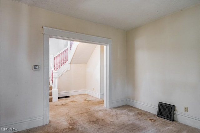 1407 Andrew St, Parkersburg, WV 26101 - spare room featuring carpet floors and stairway