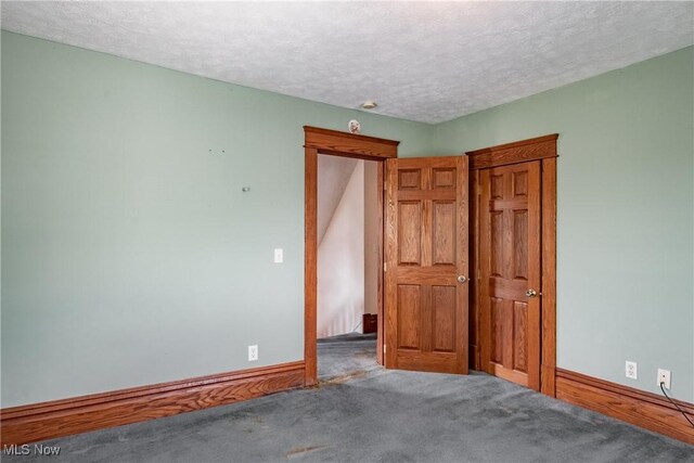 1407 Andrew St, Parkersburg, WV 26101 - unfurnished bedroom featuring a textured ceiling and carpet flooring